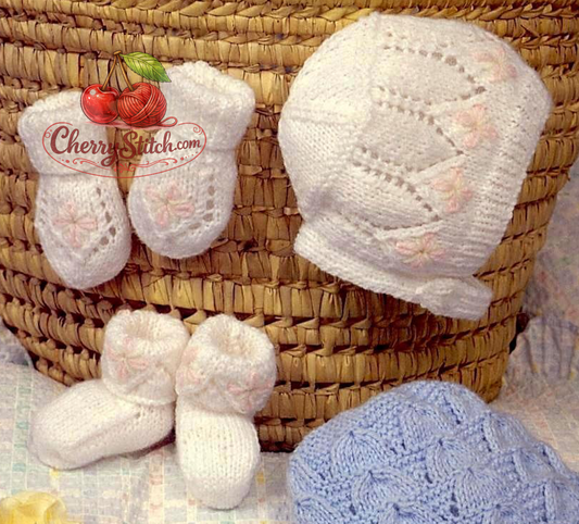 Detail of vintage 1970s baby hat, mitts and bootees set in white knitting pattern — 2 sets for baby boy and girl. Restored large print design, cap, bonnet, mittens and slippers, DK yarn.