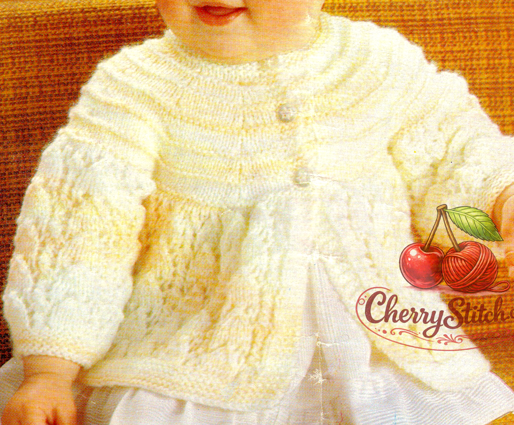 Close-up of horseshoe lace flared skirt detail – restored vintage 1970s baby matinee coat cardigan knitting pattern in DK or 4-ply
