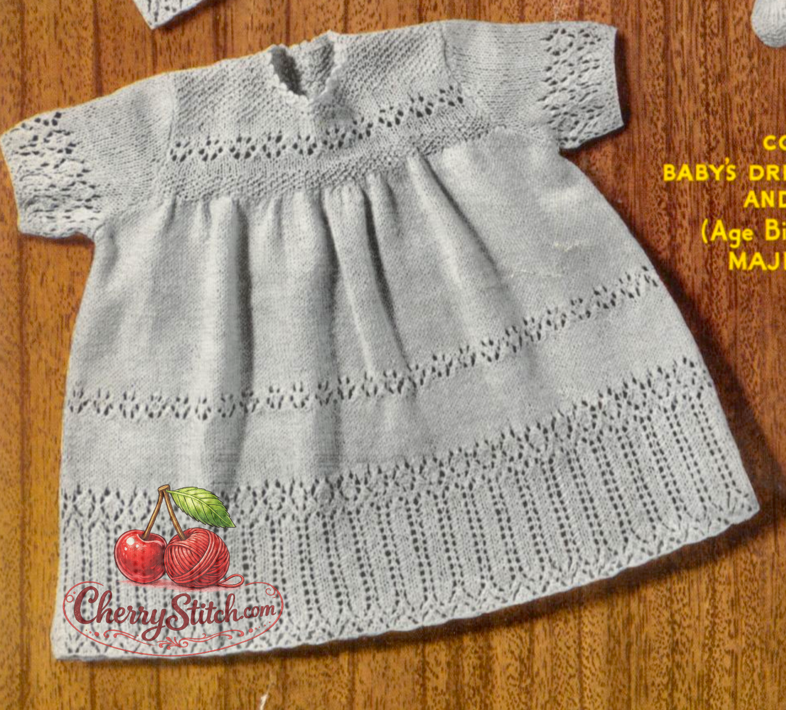 Close-up of intricate lace panel skirt and gathered waistline – restored vintage 1940s Wartime baby dress knitting pattern in 2-ply