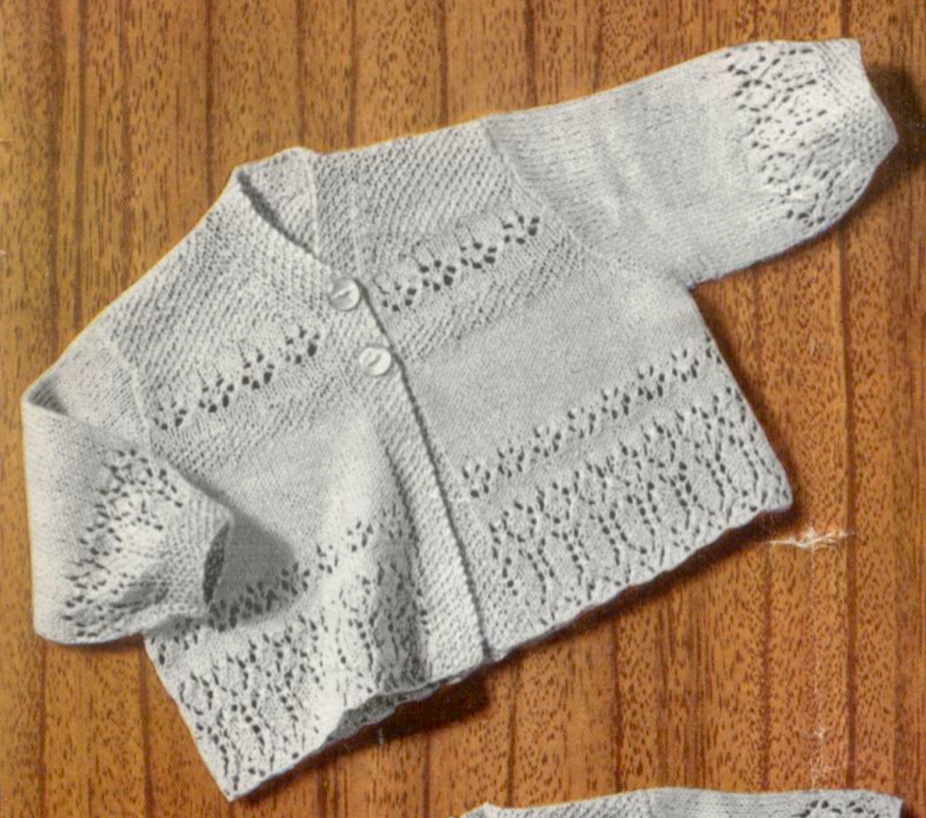 Close-up of matching lace detail on open-front matinee coat cardigan – restored vintage 1940s baby layette knitting pattern in 2-ply