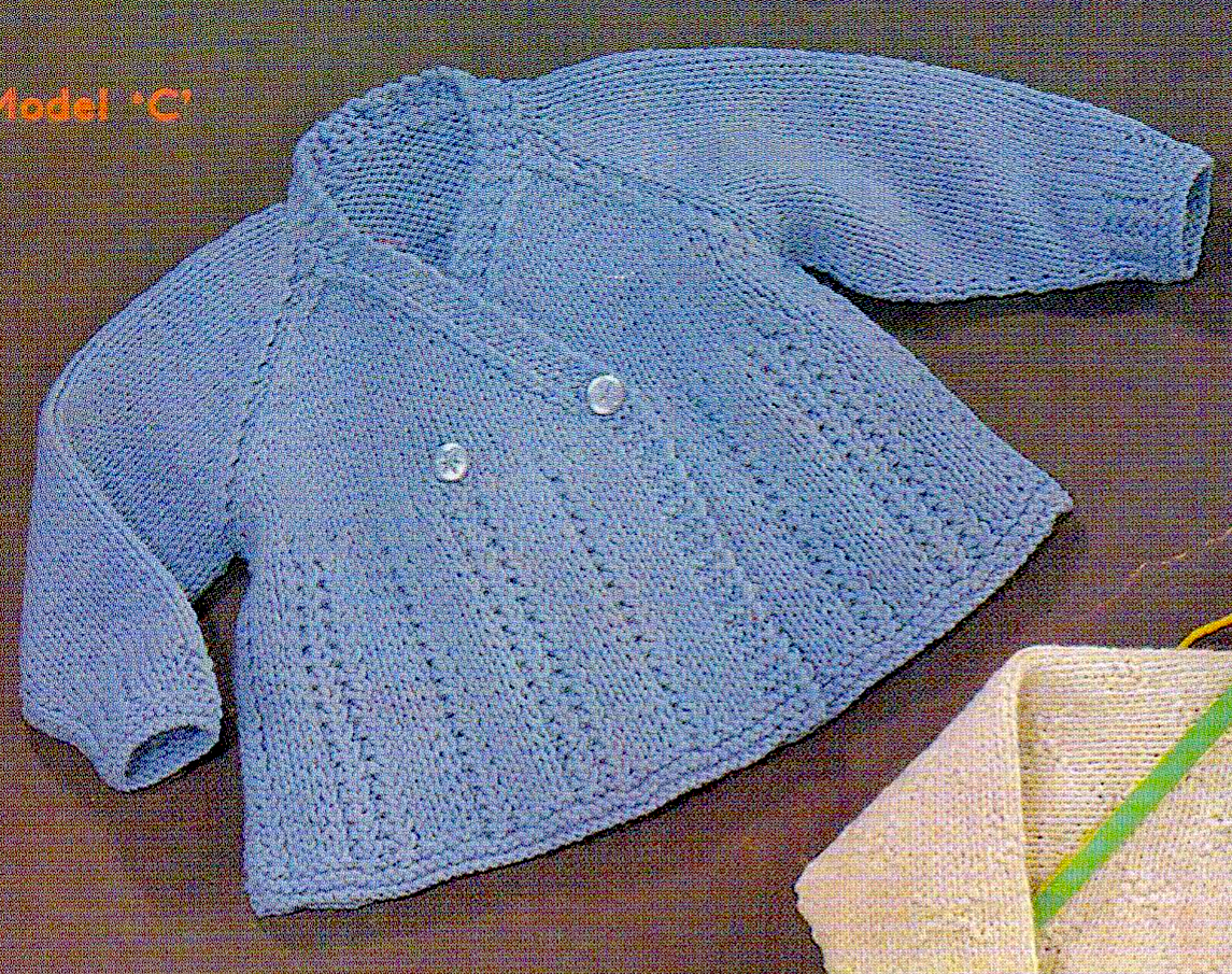Close-up of blue wrap baby cardigan with vertical lace panel skirt and raglan sleeves – restored vintage 1960s knitting pattern in DK