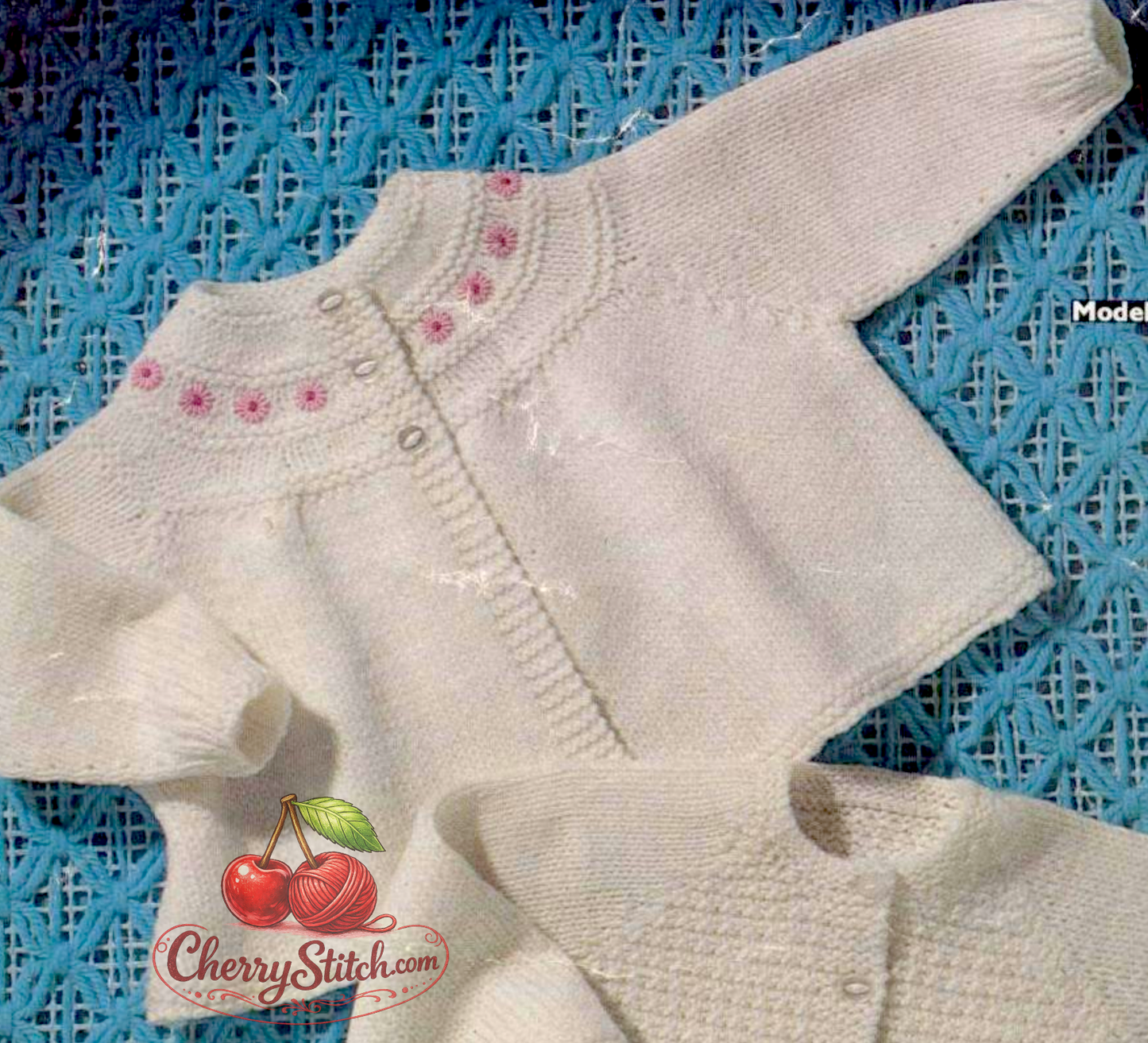 Close-up of baby cardigan with neat yoke in plain stocking stitch. Restored vintage 1960s knitting pattern in DK, clean classic finish.