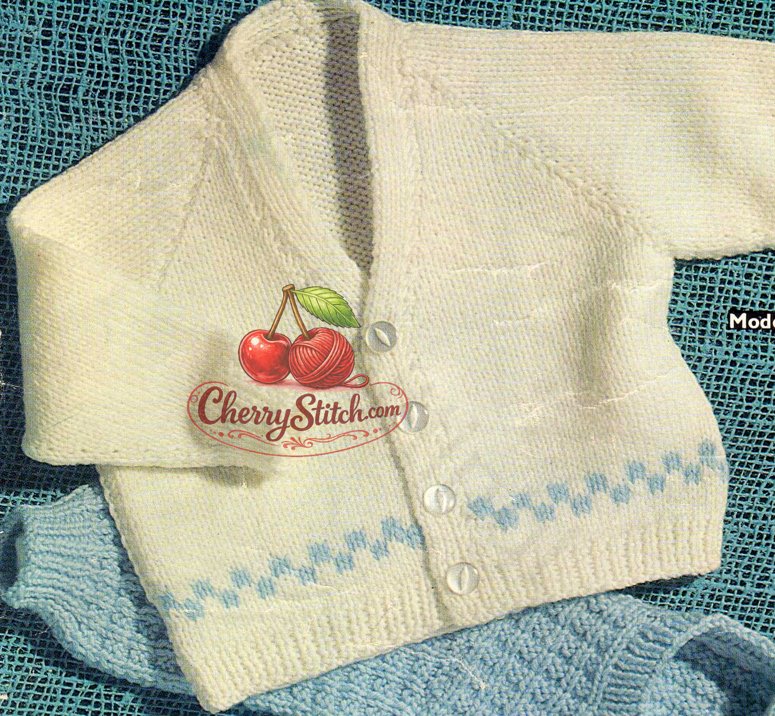 Close-up of baby boy V-neck cardigan in stocking stitch with horizontal intarsia panel detail. Restored vintage 1970s knitting pattern in DK.