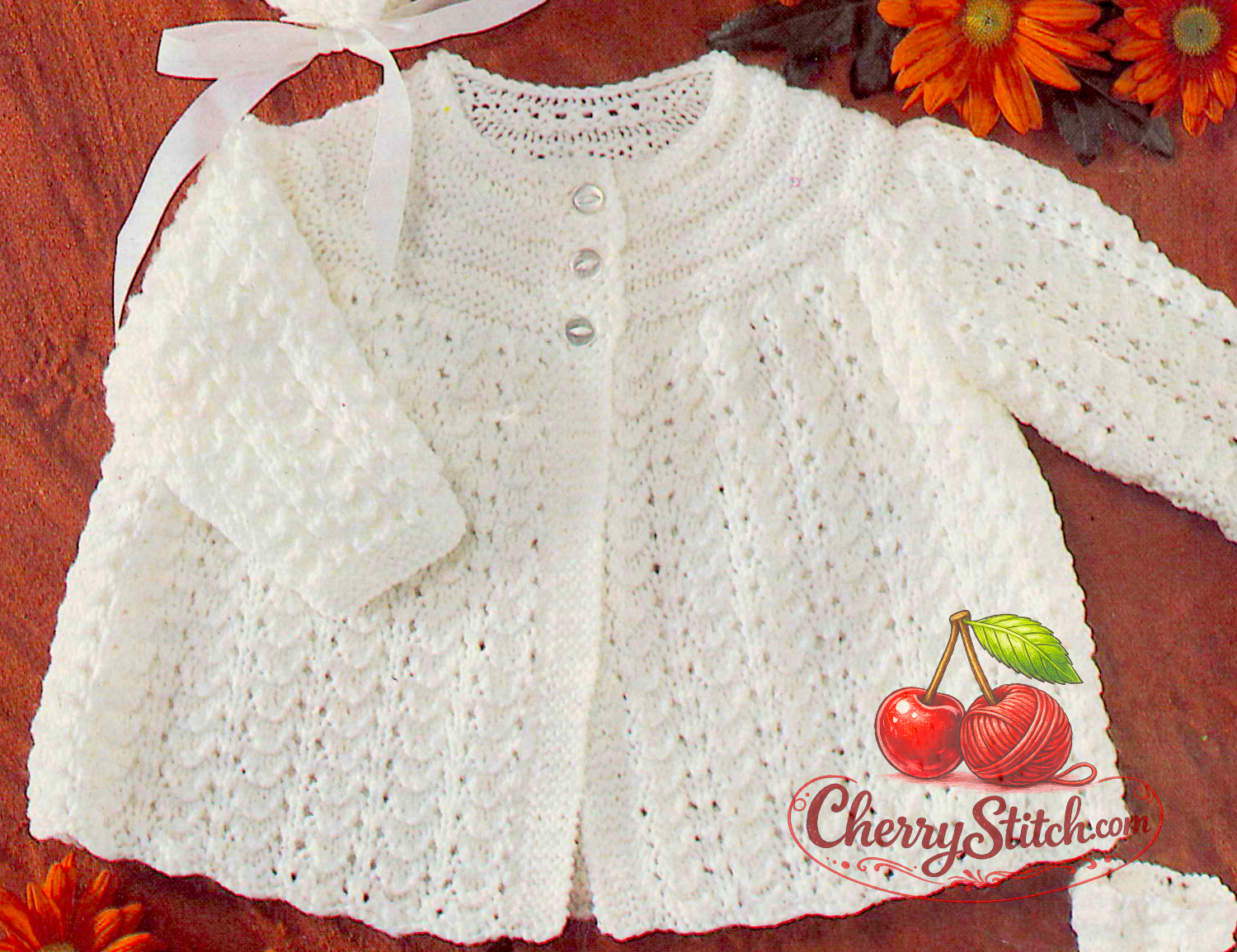 Close-up of flowing openwork lace skirt on vintage 1970s Sirdar baby matinee coat. Restored knitting pattern in DK — a timeless classic kept in print for decades.