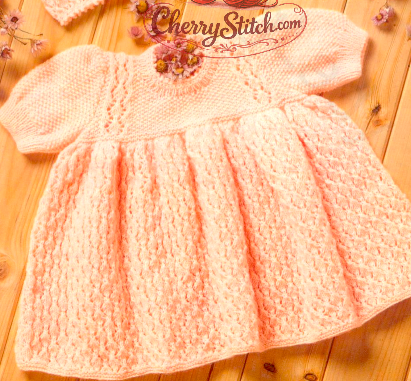 Close-up of the short-sleeved dress from vintage 1980s baby girl dress, matinee coat and bonnet set knitting pattern. Restored design in 4ply moss stitch and lace.