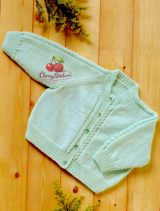 Vintage 1970s baby boy girl classic raglan cardigan knitting pattern. Horizontal cable panels on sleeves and button bands, round neck. 4ply, 16''–22'', Birth to 2 years.