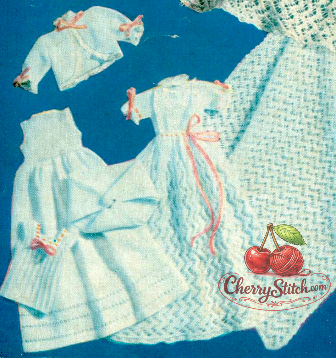 Close-up of the 7-piece royal lace miniature layette from vintage 1940s Weldons baby doll knitting pattern. Restored wartime design in 4-ply — an exquisite christening or holiday gift set.