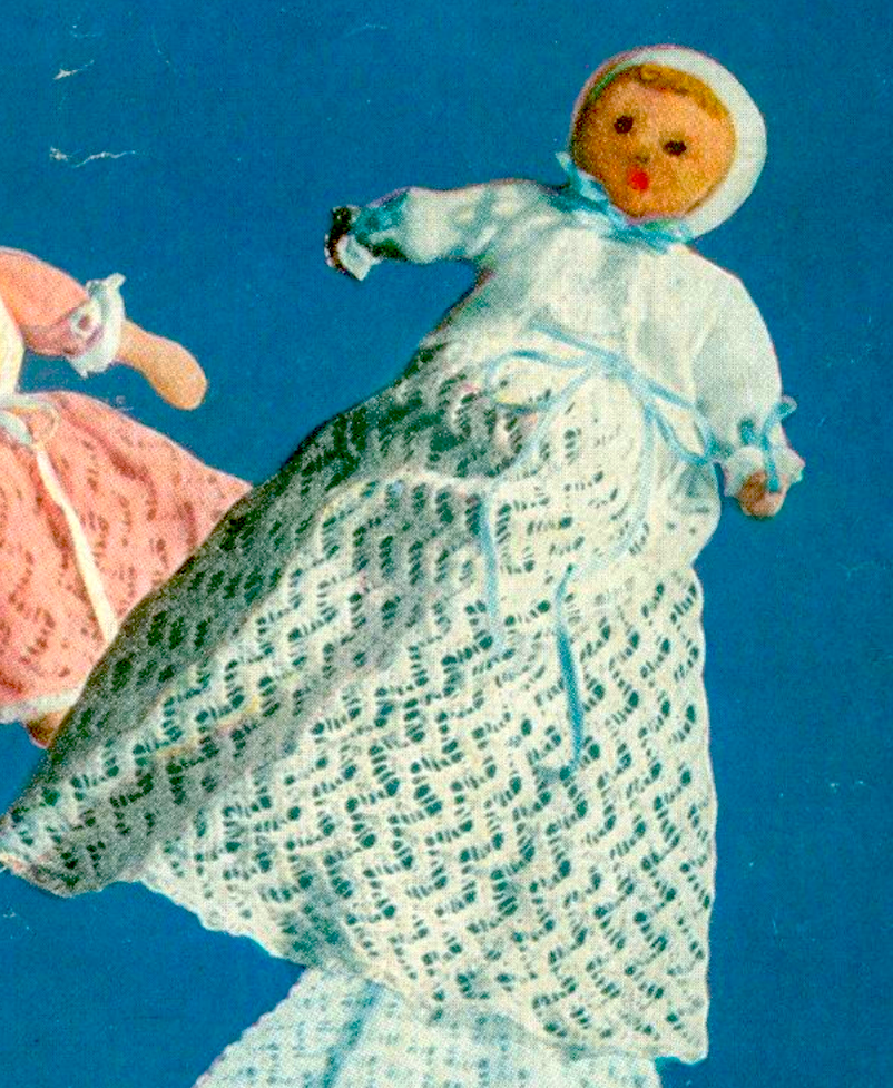 Close-up of the knitted 10'' soft baby doll from vintage 1940s Weldons lacy layette knitting pattern. Restored wartime design in 4-ply — a charming, one-of-a-kind heirloom piece.