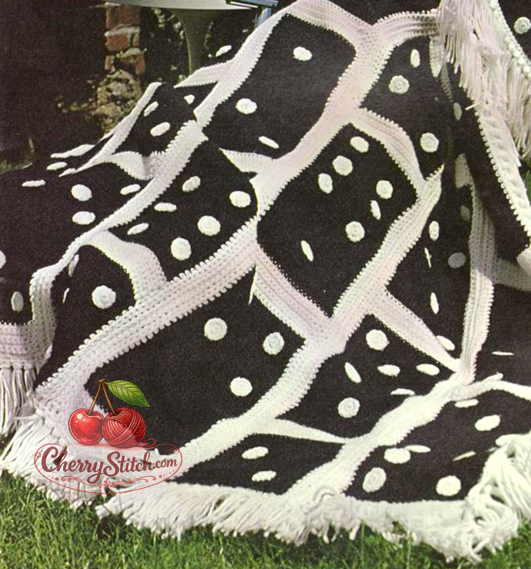 Close-up of domino tile strip detail on vintage 1968 crochet afghan blanket pattern. Restored retro boho design in two colours — Worsted Aran, full fringe edging, bold graphic 60s style.