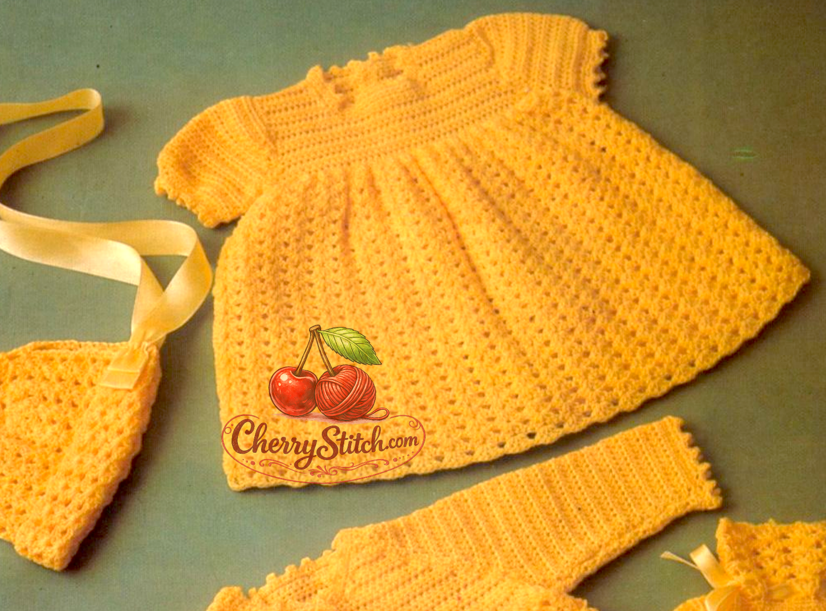 Close-up of shell stitch skirt on vintage 1970s baby layette crochet pattern. Restored classic design — generous wide shell stitch flowing from raglan bodice, 4ply yarn. UK crochet terms.
