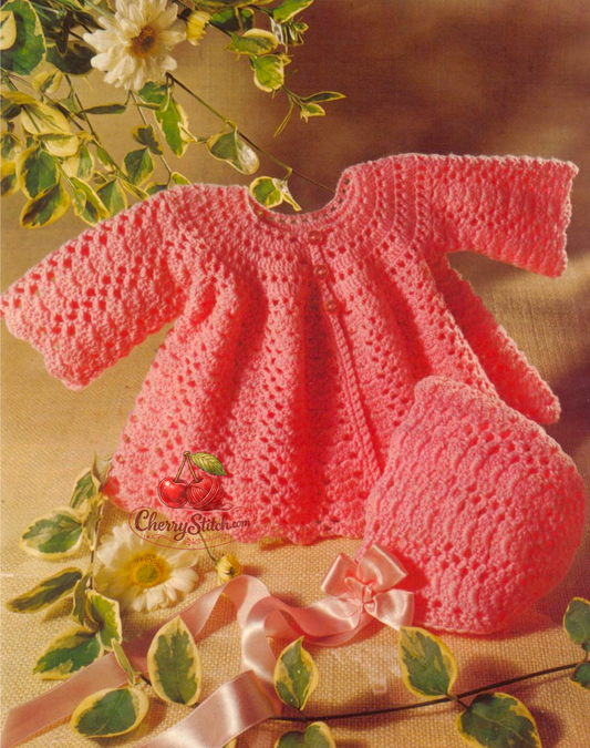 Vintage 1970s baby matinee jacket and bonnet crochet pattern. All-over lace stitch, yoke construction worked top-down, wide lacy skirt, 3 buttons. 4ply yarn, 19'' – 20'' (48 – 50 cm), approx. 6 – 12 months. UK crochet terms.