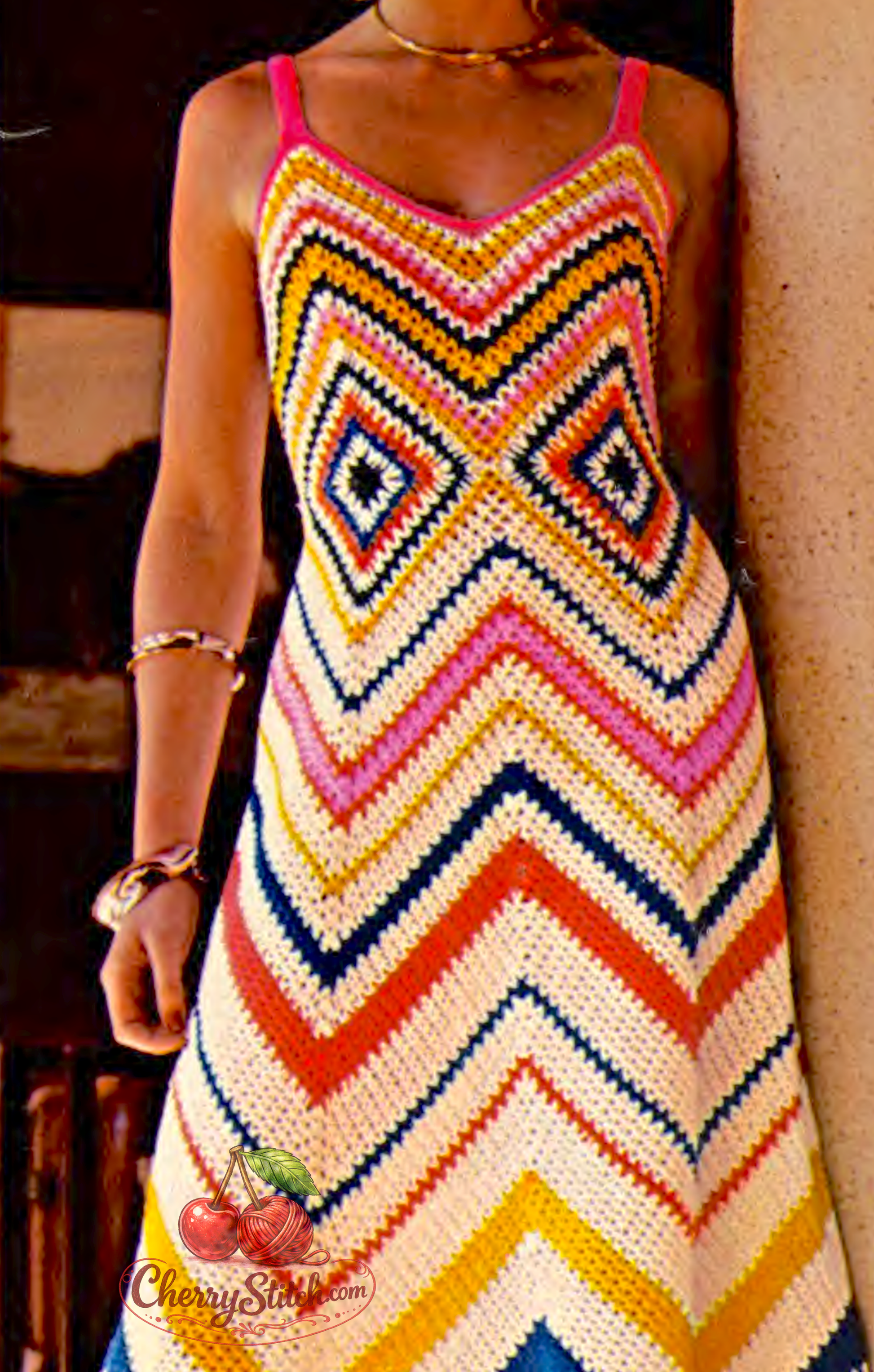 Close-up of classic large chevron ripple stitch on vintage 1970s women's long dress crochet pattern. Restored boho beach design — flowing ripple from shoulder to hem, 4ply yarn. US crochet terms.