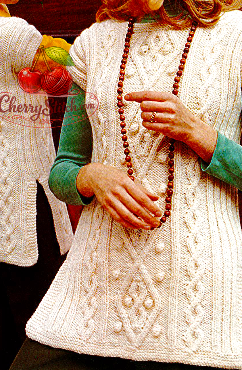 Close-up of bold diamond cable panel detail on vintage 1970s women's and girls' cable tunic knitting pattern. Restored retro design — rich traditional texture, Aran yarn. Round neck, drop shoulders, side slits.