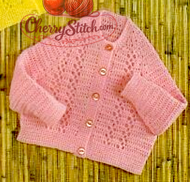 Close-up of vintage 1980s baby pink round neck crochet cardigan