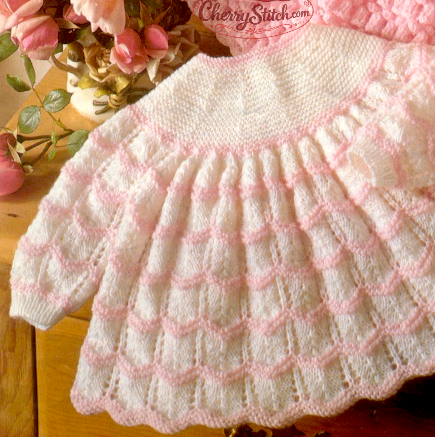 Close-up of lace stitch detail on vintage 1970s baby angel top knitting pattern. Restored heirloom design — two pretty lacy options, 4ply yarn.