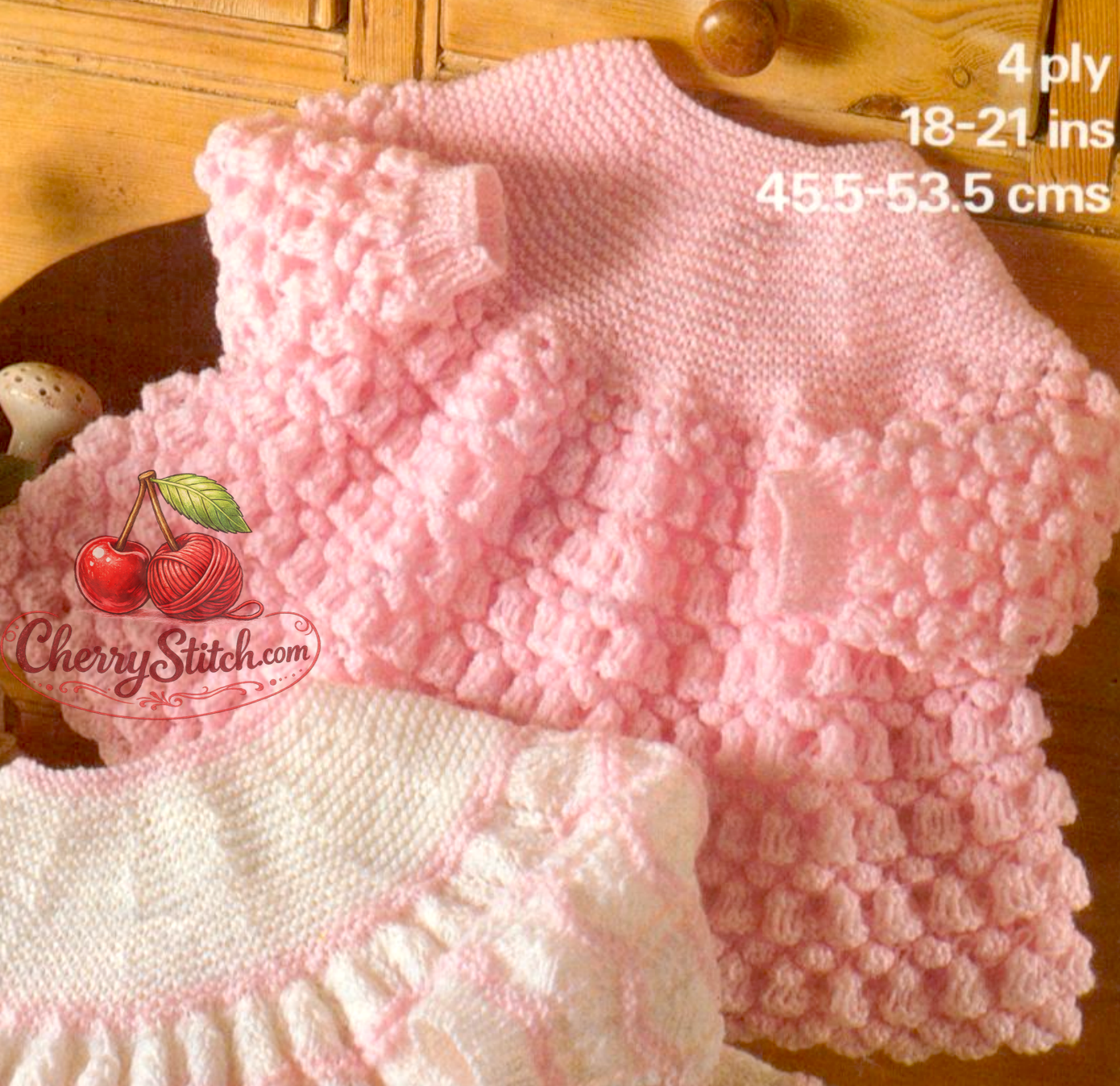 Close-up of lace stitch detail on vintage 1970s baby angel top knitting pattern. Restored heirloom design — two pretty lacy options, 4ply yarn.