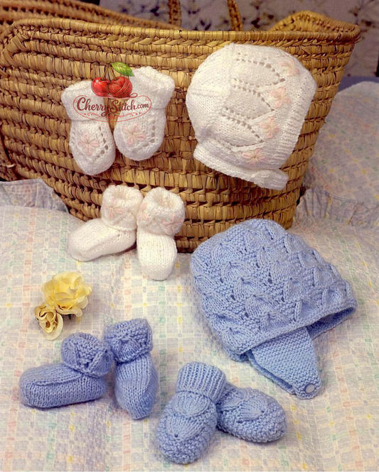 Vintage 1970s baby hat, mitts and bootees knitting pattern — 2 sets, one for baby girl (white, 0–6 months) and one for baby boy (blue, 0–6 months and 6–12 months). Cap, bonnet, mittens and slippers. Large print pattern, DK yarn, worked on two needles. Intermediate knitting.