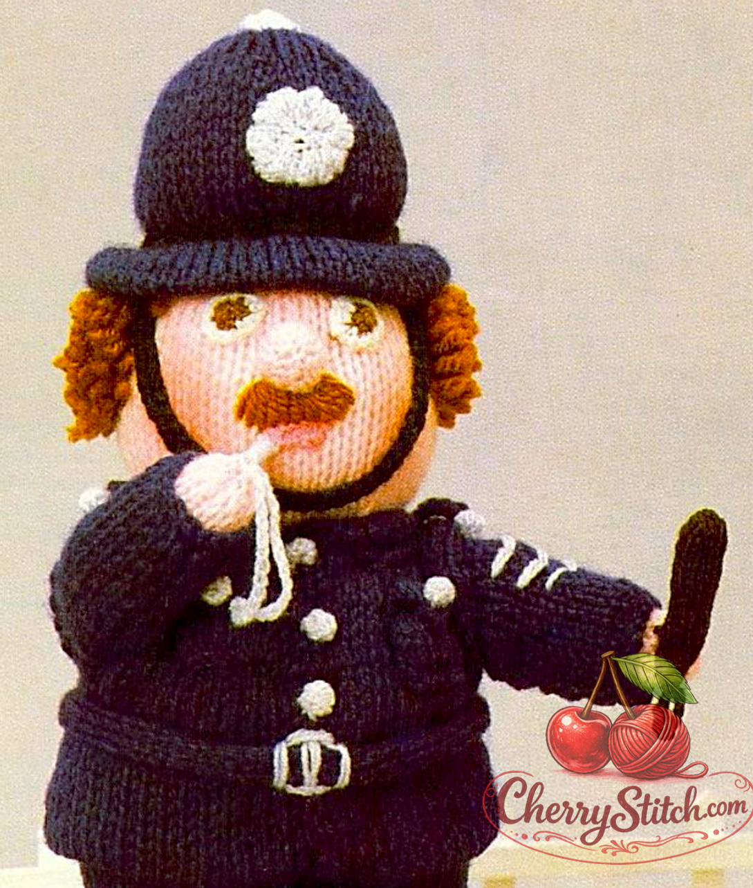 A close-up of a vintage Woolly Wotnots Policeman doll — soft stuffed toy, 12'' (30 cm) tall. Charming retro character doll, DK, 4ply and chunky yarn. Great gift idea for baby and child. Intermediate knitting.

