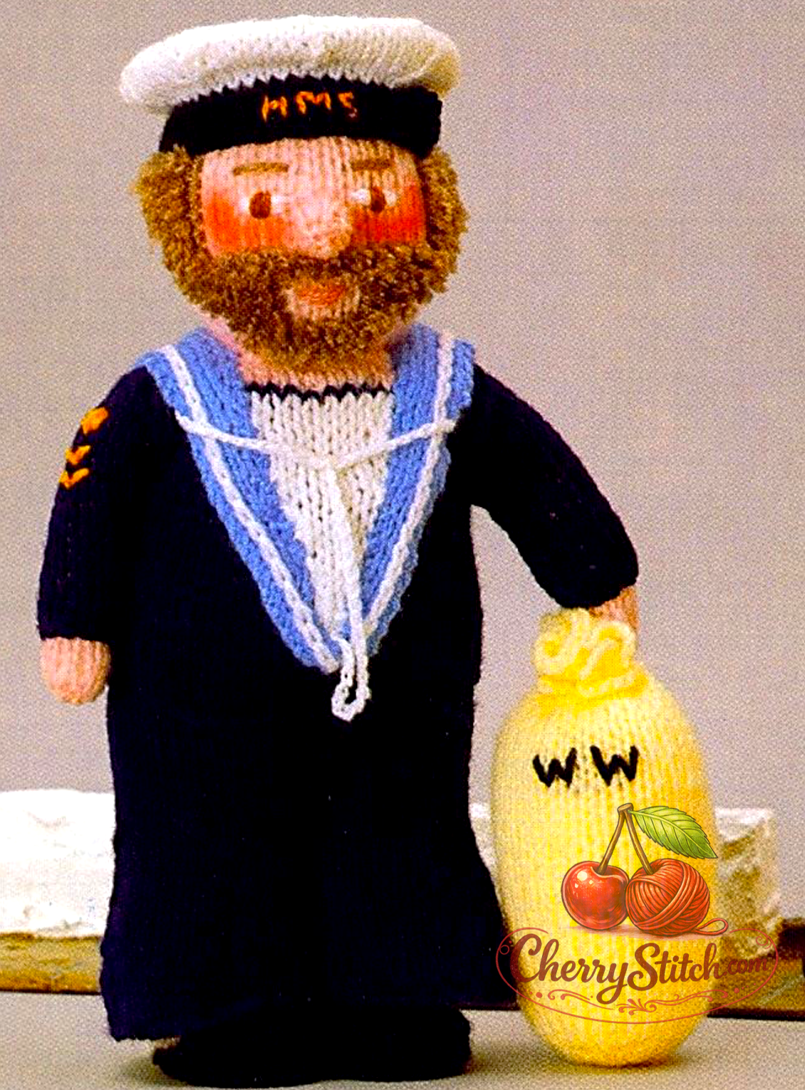 A detailed view of Woolly Wotnots Sailor doll and Kit Bag — soft stuffed toy, 12'' (30 cm) tall. Adorable retro nautical character doll, DK and 4ply yarn. Great gift idea for baby and child. Intermediate knitting.

