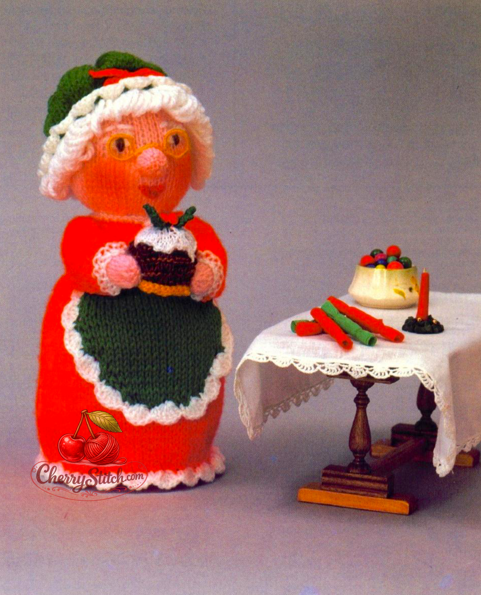 Vintage Woolly Wotnots Mother Christmas and Pudding knitting pattern — soft stuffed toy doll, 12'' (30 cm) tall. Charming festive character holding a plate with Christmas Pudding. DK, 4ply and chunky yarn. Wonderful Christmas gift idea and home decoration. Intermediate knitting.