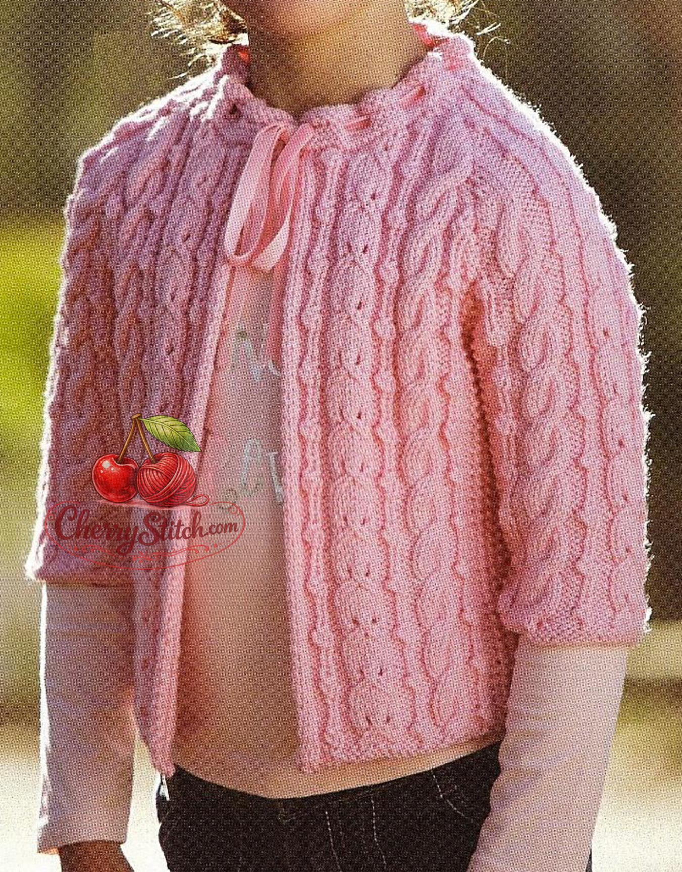 Cable stitch detail from vintage girl's Aran open front jacket knitting pattern — raglan sleeves, elbow length, DK yarn, 52–75 cm, 1–10 years.