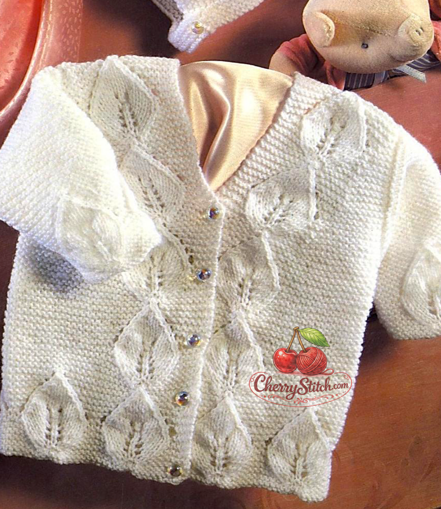 Leaf panel detail from vintage baby jacket and bonnet knitting pattern — V-neck, 4ply yarn, 16''–20'', birth to 12 months.