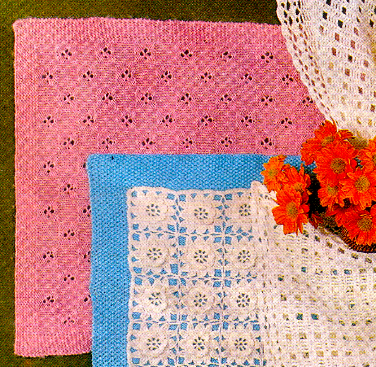 Close-up of delicate pink knitted lace baby cover – restored vintage 1980s pattern