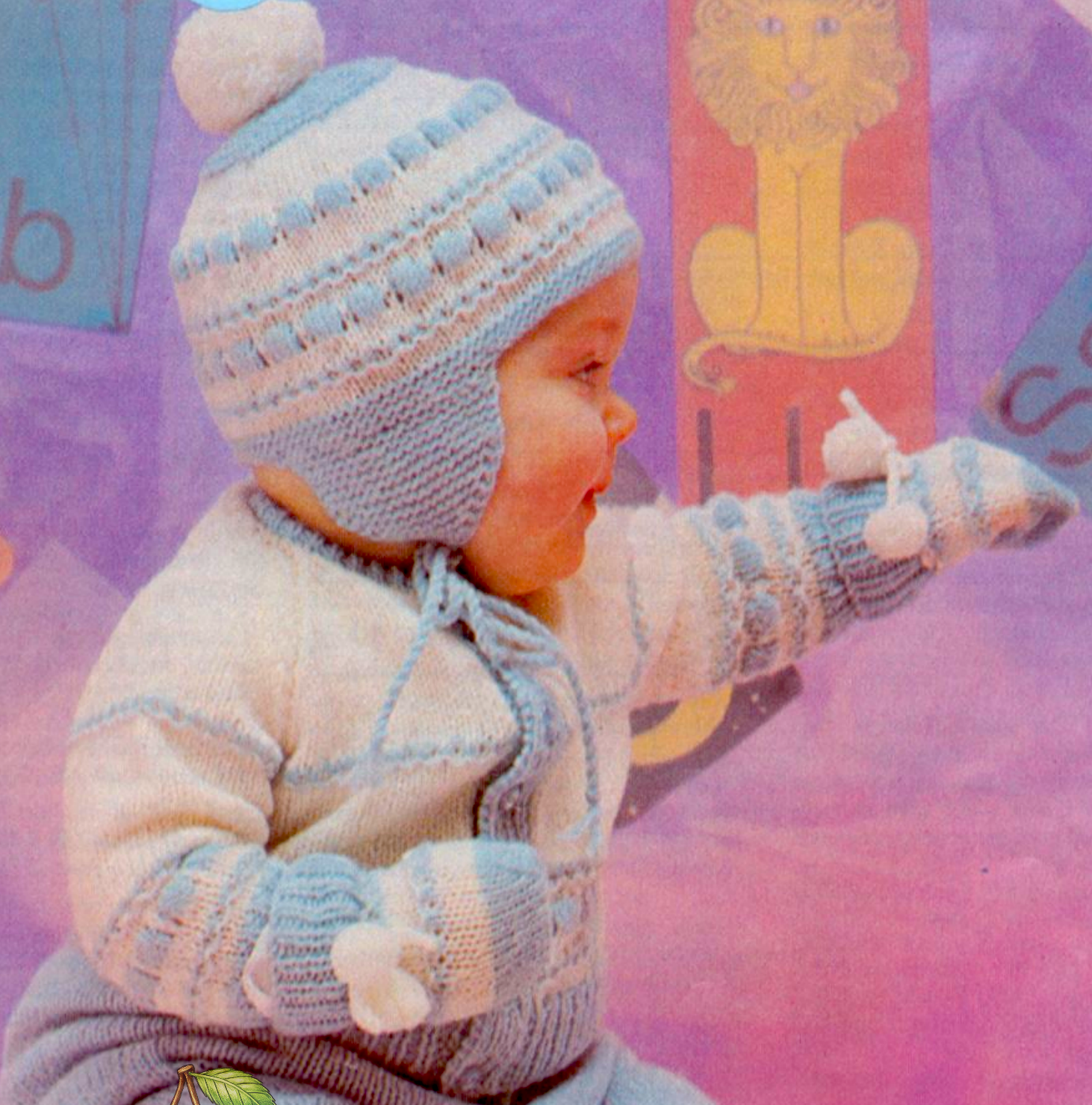 Close-up of raglan jacket and helmet with bold raised stitch bands in white and blue – restored vintage 1970s baby boy knitting pattern in 4-ply