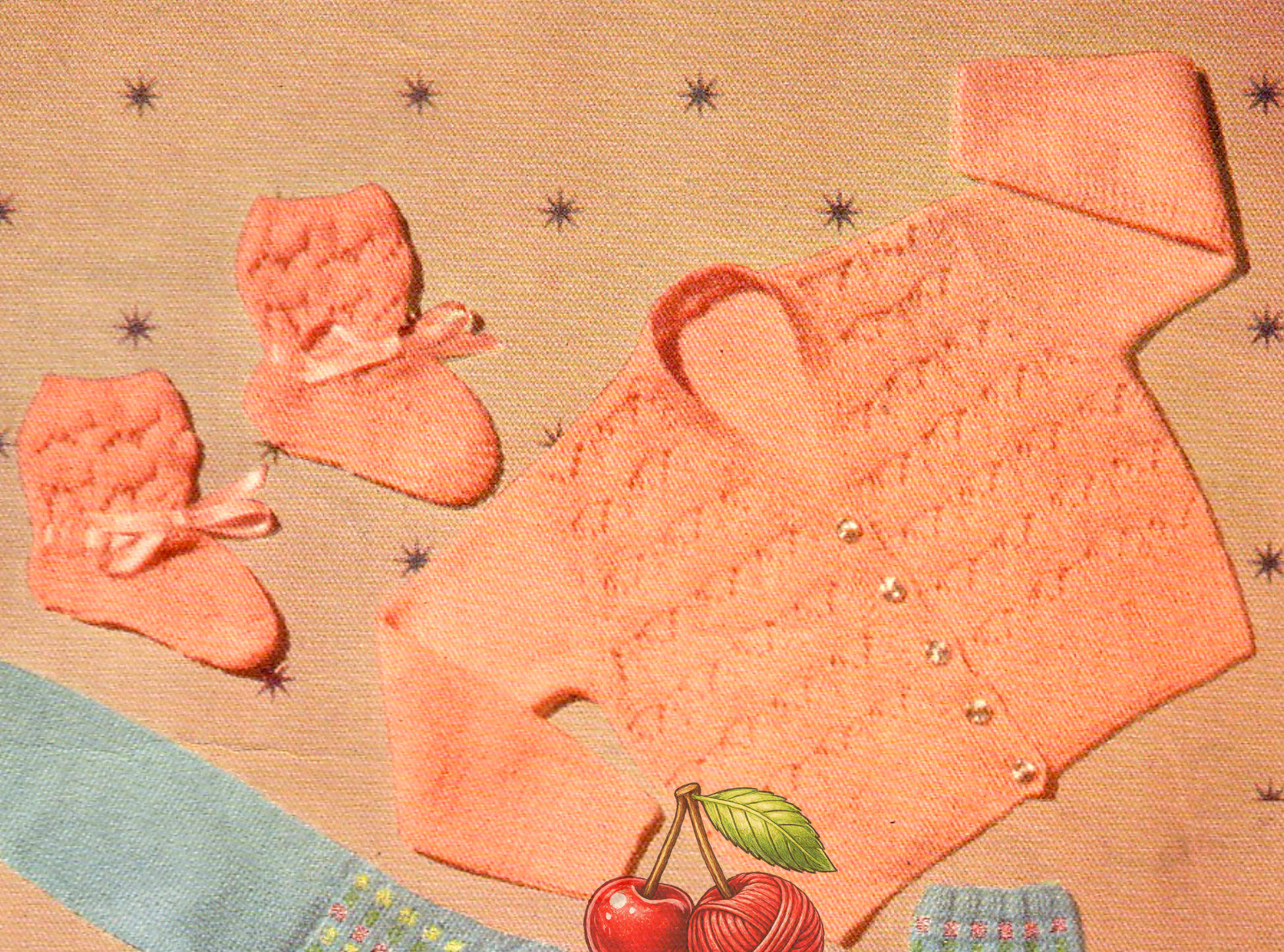 Close-up of cardigan and bootees in vintage 1950s Lavenda baby knitting pattern