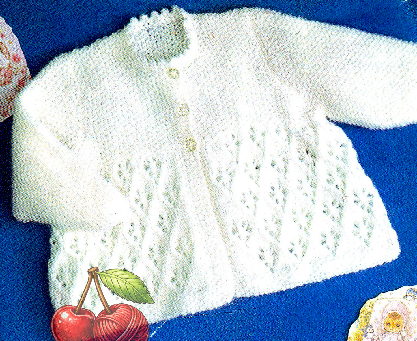 Close-up of all-over lace skirt and smooth bodice on baby lacy matinee coat – restored vintage 1980s knitting pattern in DK