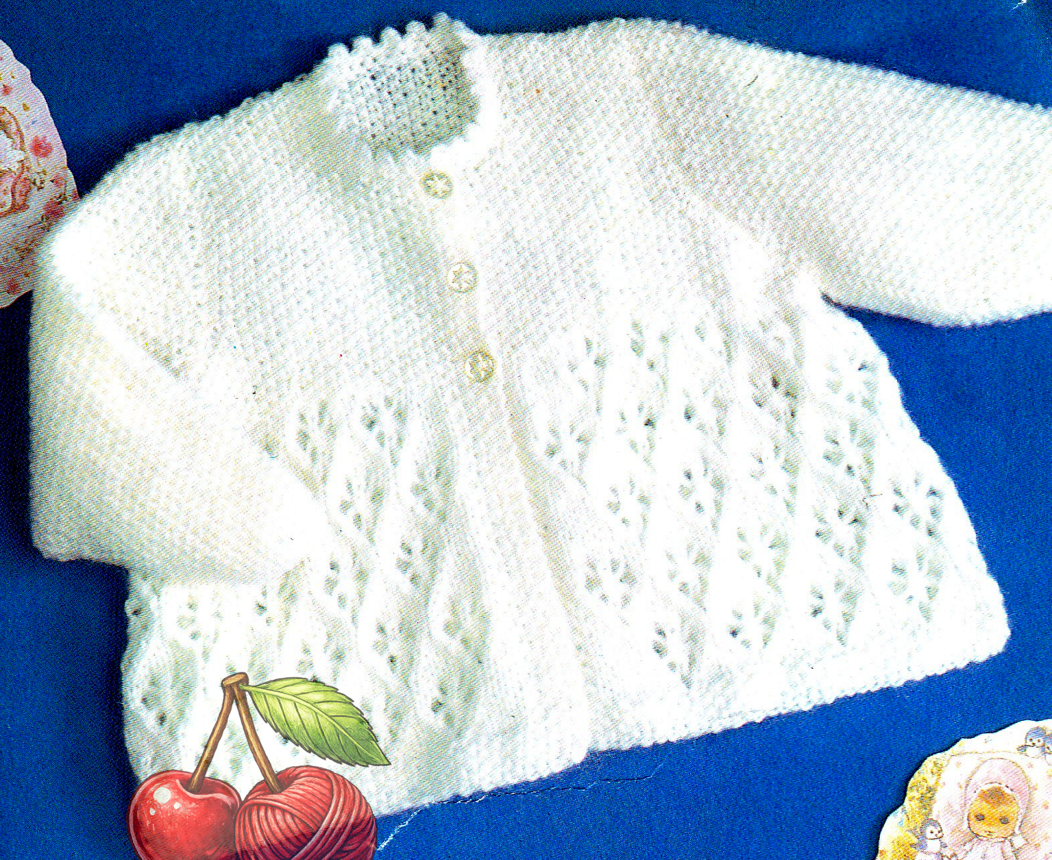 Close-up of all-over lace skirt and smooth bodice on baby lacy matinee coat – restored vintage 1980s knitting pattern in DK