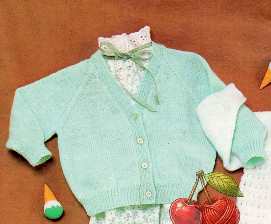 Close-up of plain stocking stitch V-neck raglan baby cardigan – restored vintage 1970s knitting pattern in 3-ply
