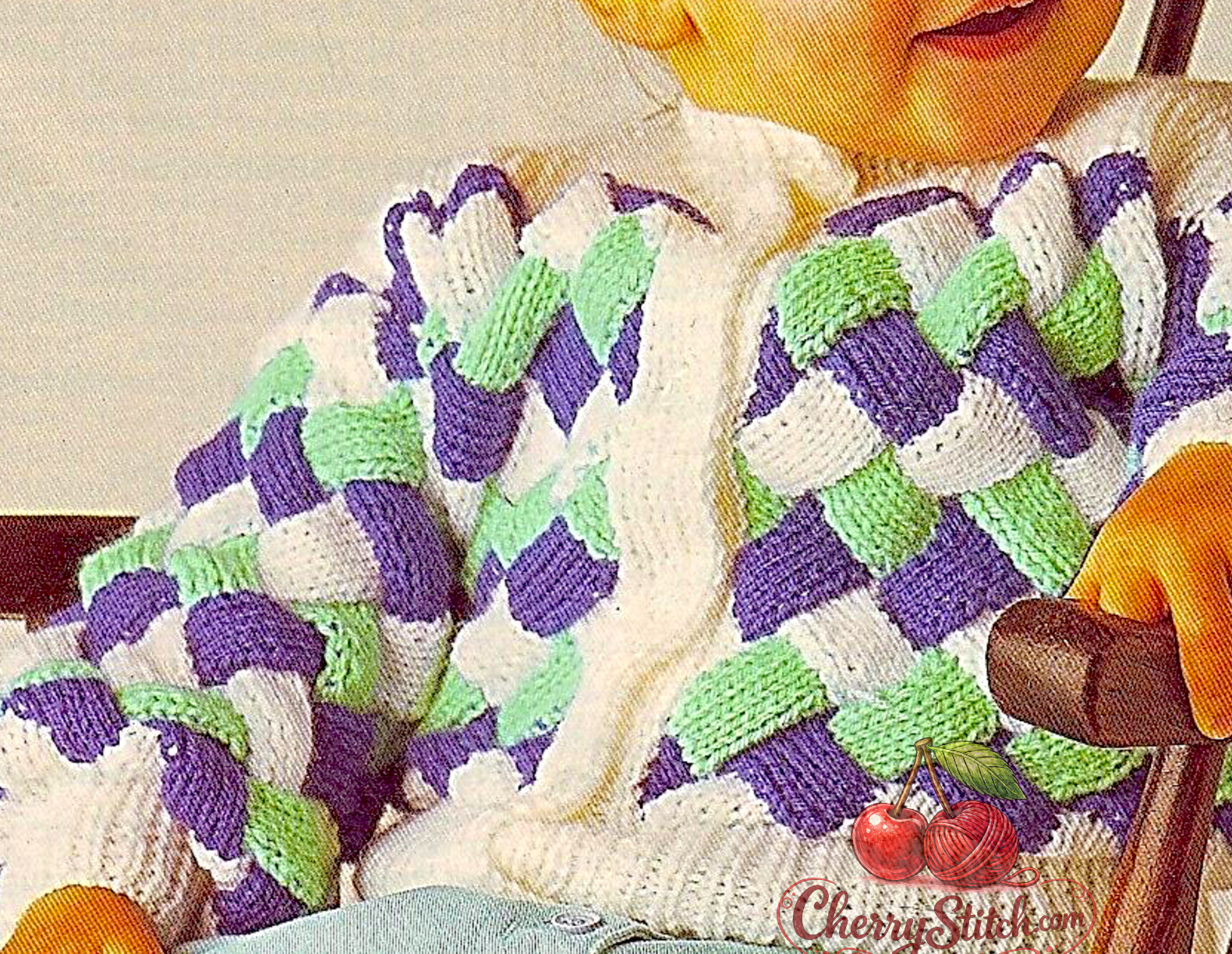 Close-up of three colour entrelac stitch detail – restored vintage 1980s baby child cardigan knitting pattern in DK