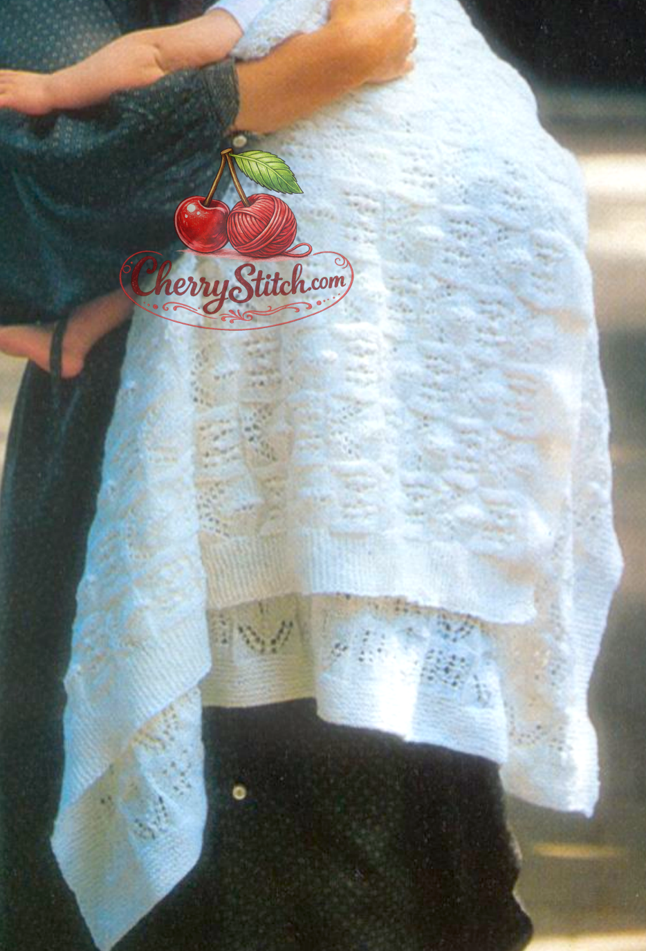 Close-up of delicate lace pattern detail on vintage 1980s baby christening shawl knitting pattern