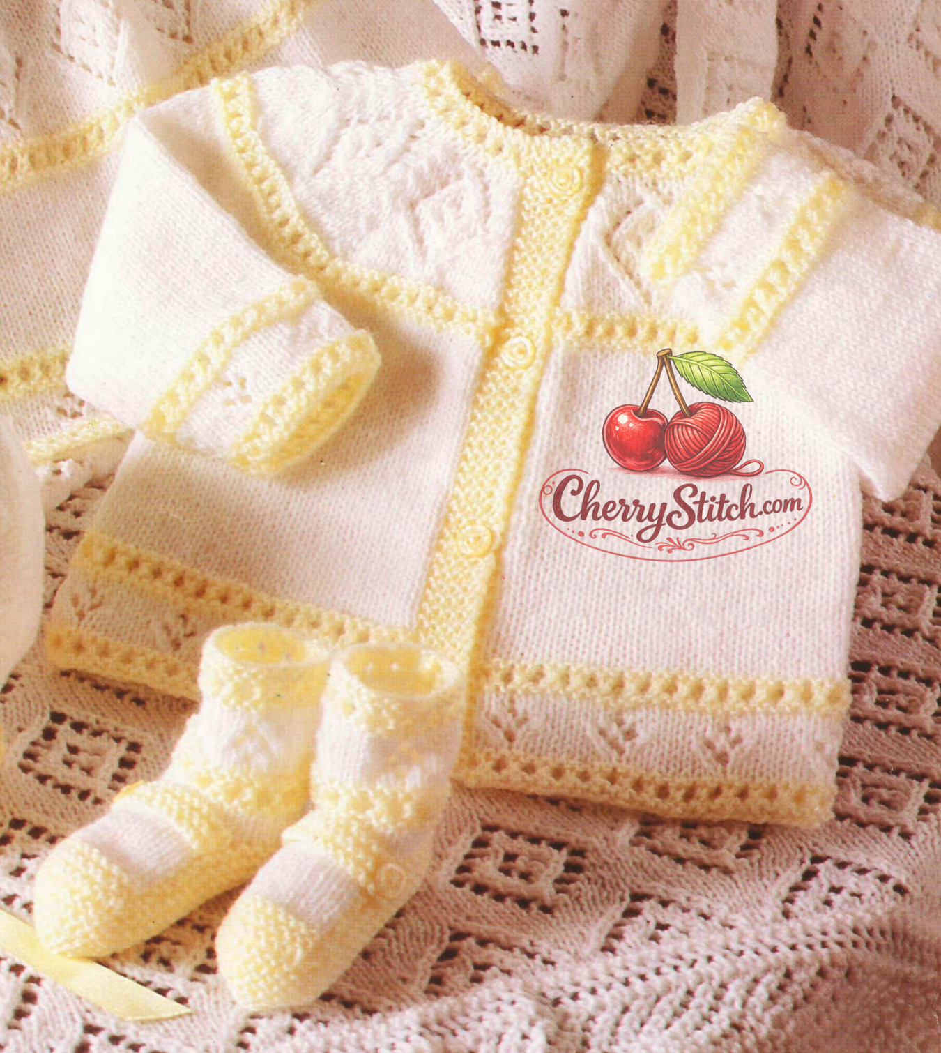 Close-up of knitted baby girl lacy diamond cardigan and bootees – restored vintage 1980s layette pattern