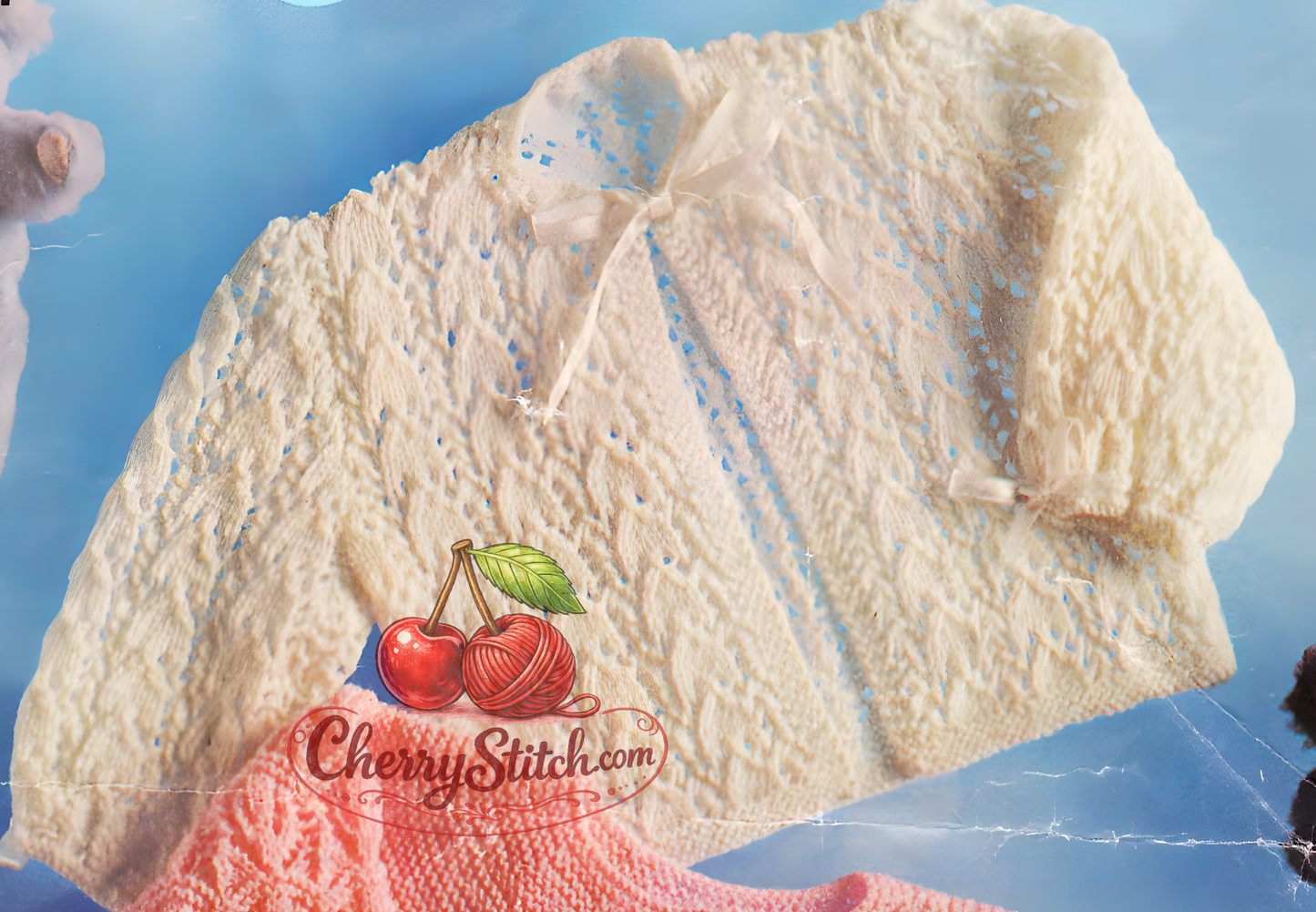 Close-up of full lacy ribbon-trimmed matinee coat – restored vintage 1970s baby knitting pattern in 4-ply