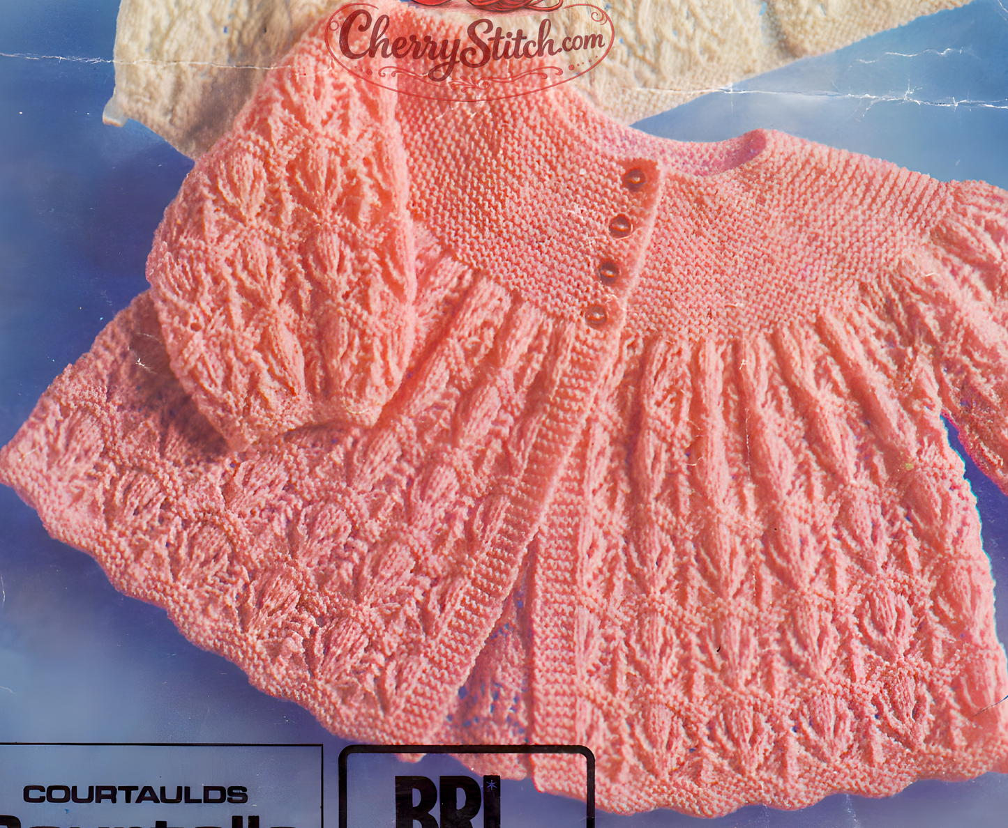 Close-up of full lacy yoke matinee coat – restored vintage 1970s baby knitting pattern in 3-ply