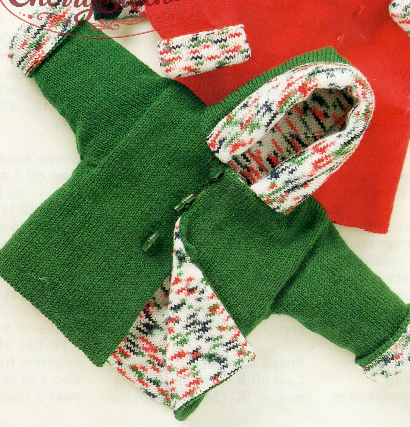 Close-up of green knitted baby lined hooded jacket – restored vintage 1990s pattern