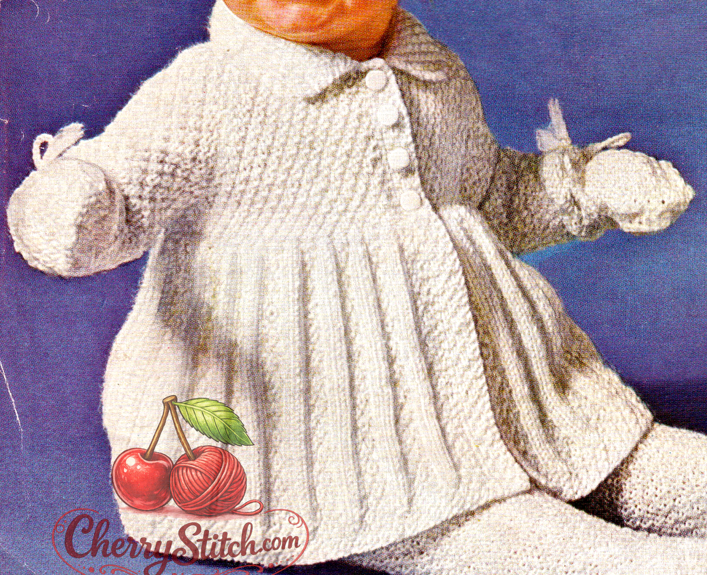 Close-up of white knitted baby coat – restored vintage 1950s Bairnswear pram set knitting pattern