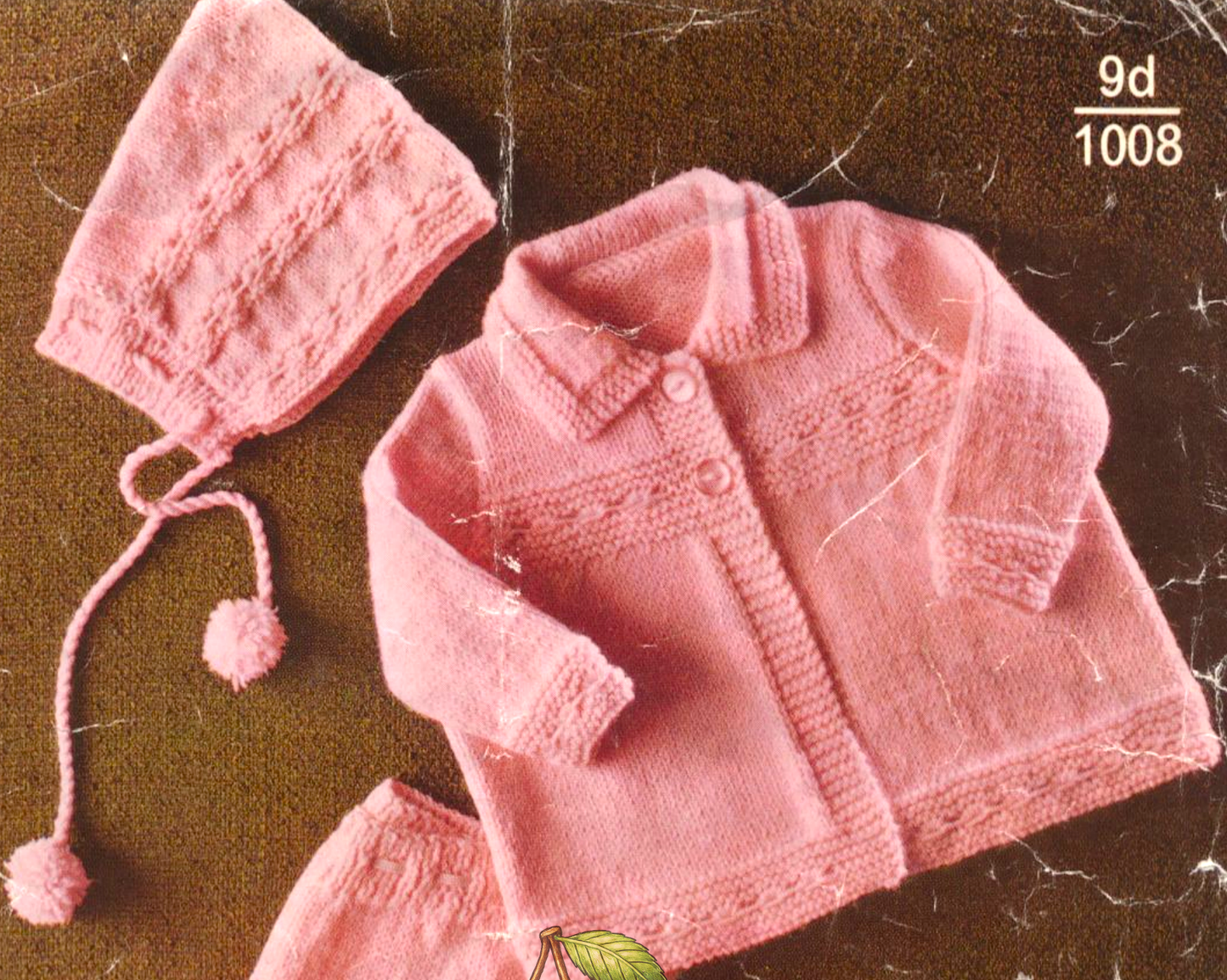 Close-up of knitted baby matinee coat and pixie hood hat – restored vintage 1960s pram set pattern