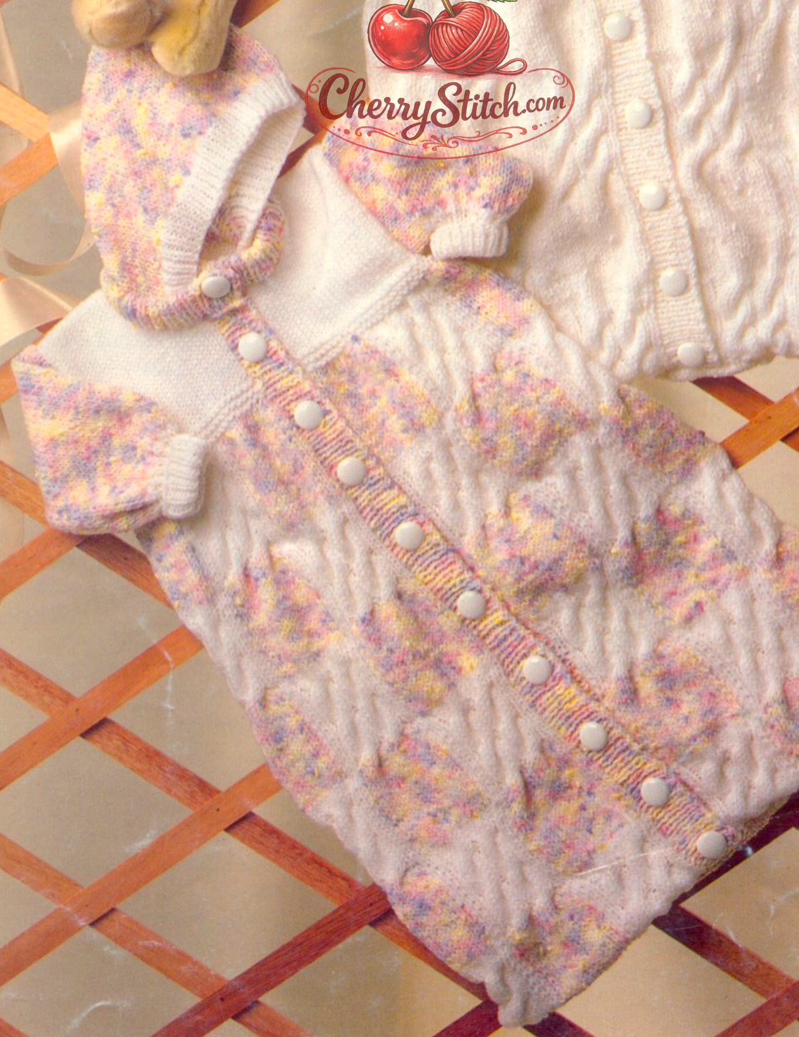 Close-up of hooded version – restored vintage 1980s baby sleeping bag knitting pattern with cable panels in DK
