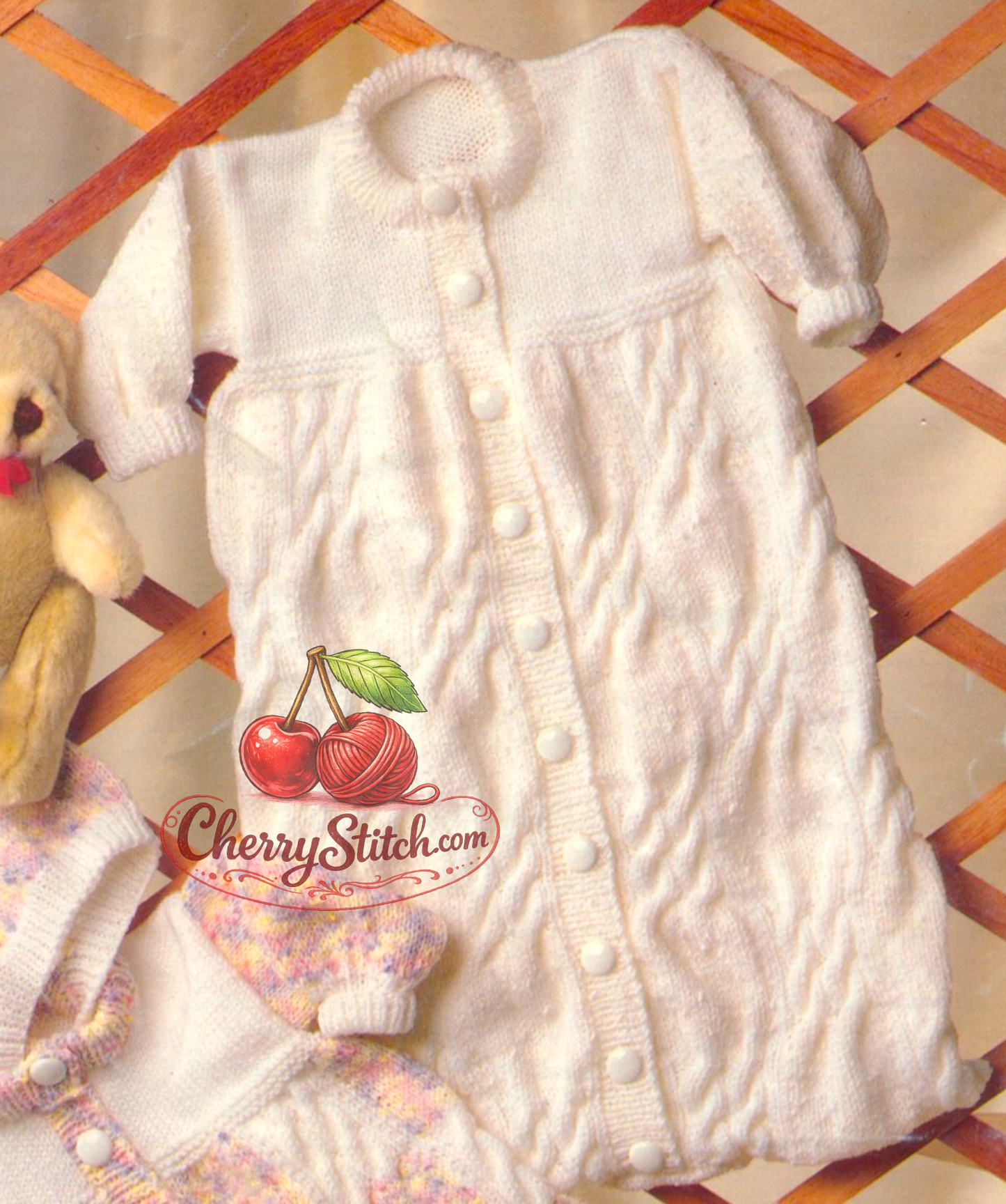 Close-up of round neck version – restored vintage 1980s baby sleeping bag knitting pattern with cable panels in DK