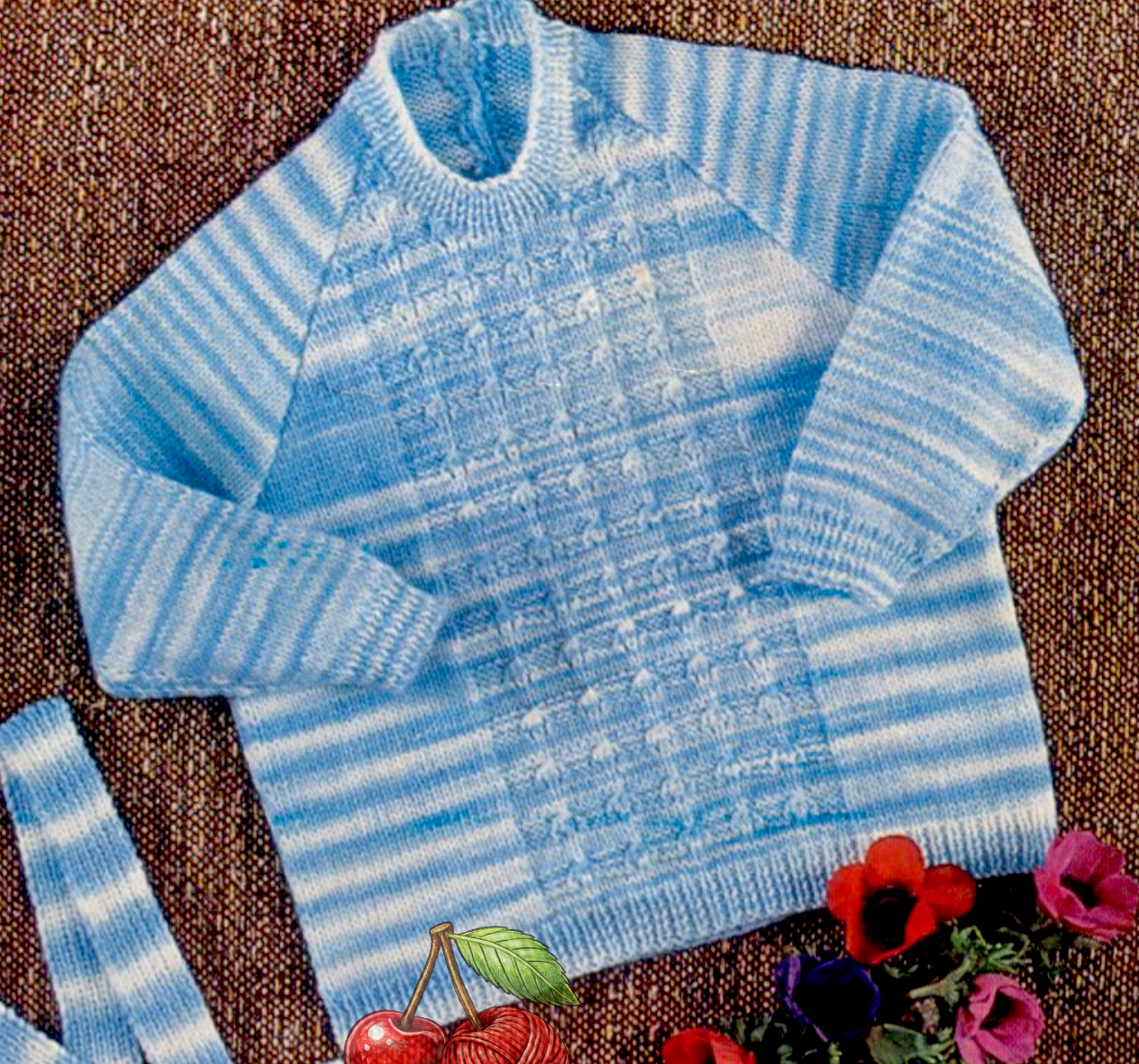 Close-up of crew neck raglan sweater with patterned front panel – restored vintage 1970s baby knitting pattern in 4-ply