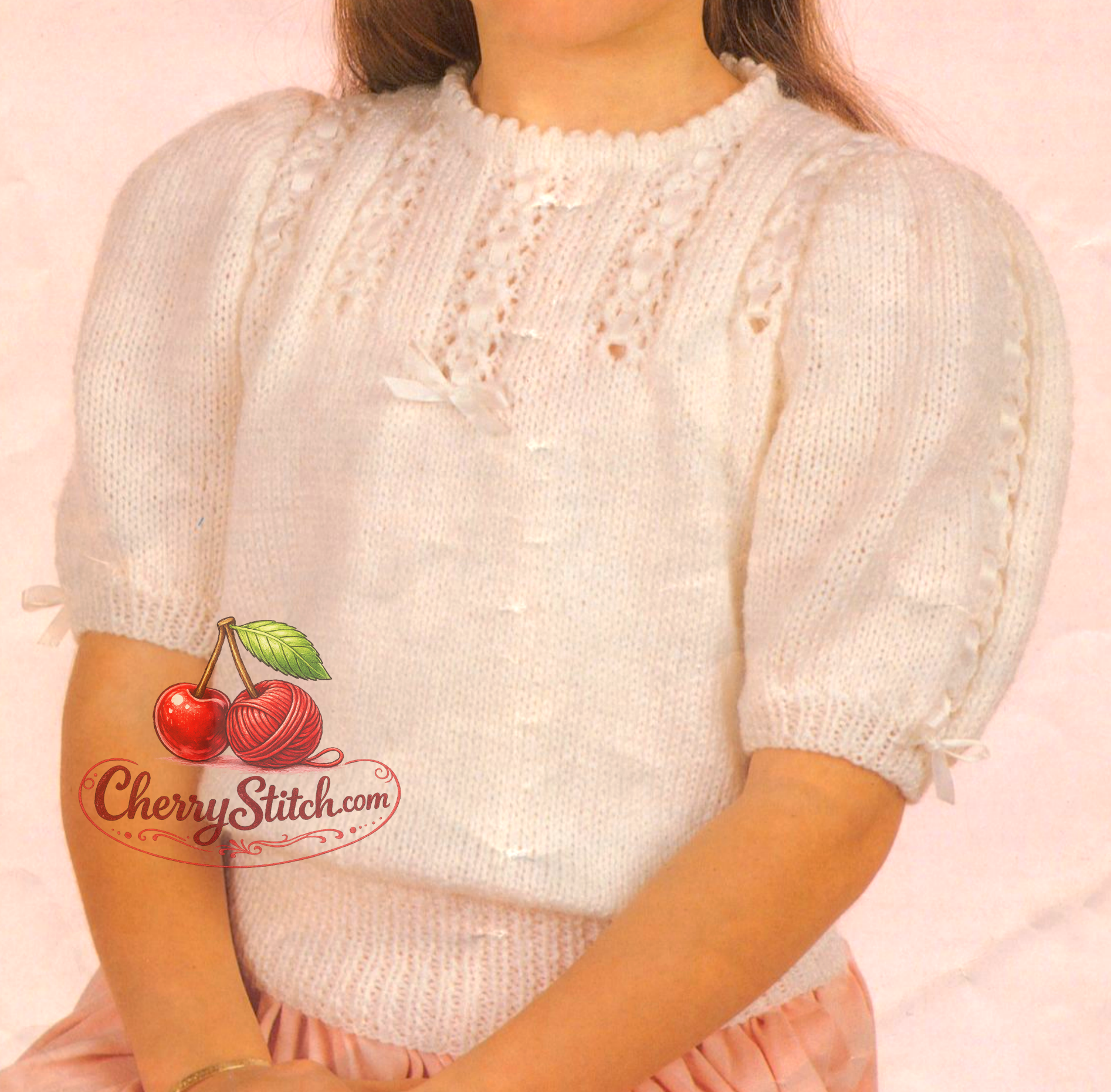 Close-up of lace front panel and vertical sleeve lace band – restored vintage 1980s girls' short-sleeved jumper knitting pattern in DK