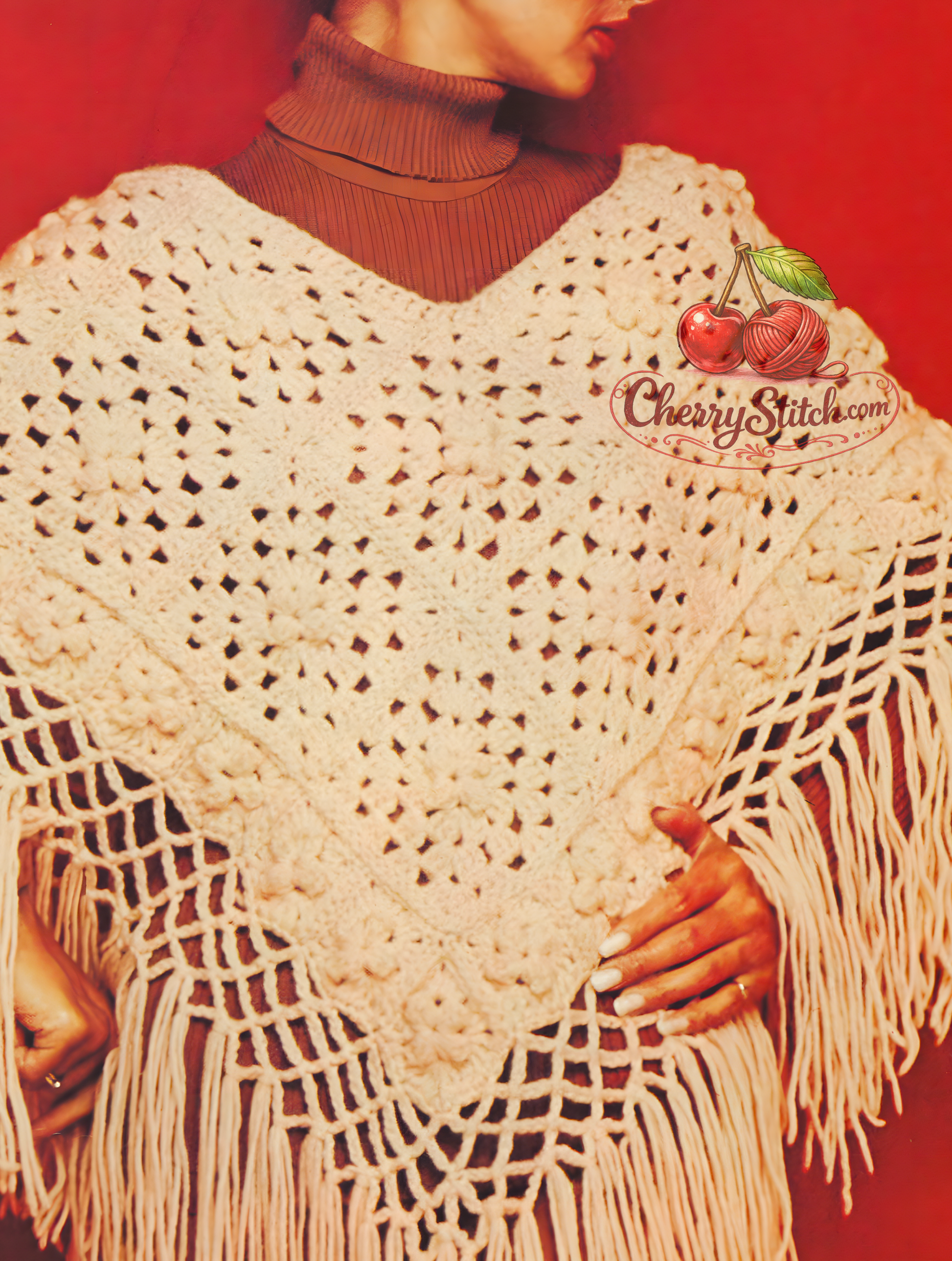 Close-up of granny square crochet detail and fringe on vintage 1980s women's poncho pattern