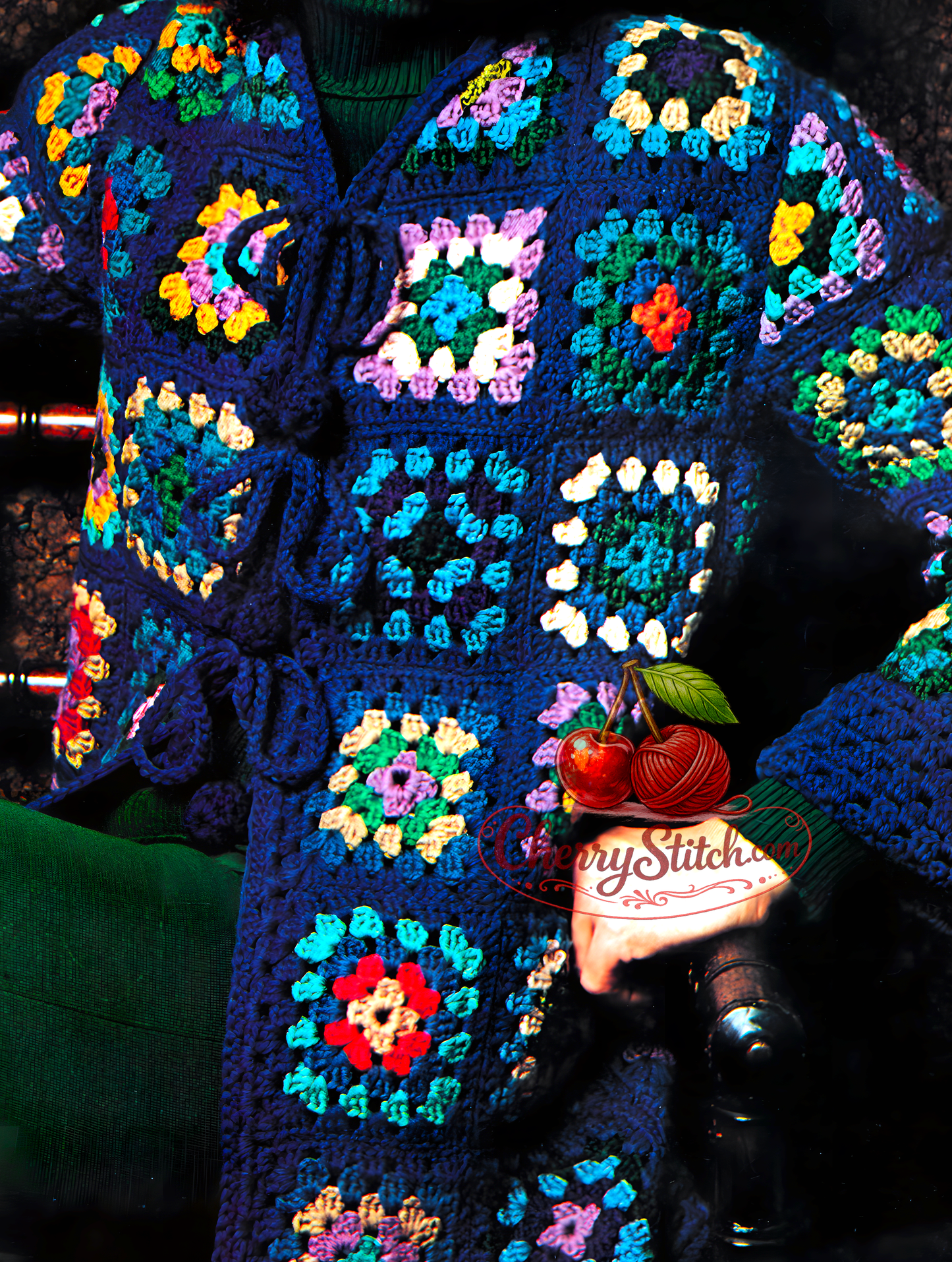 Close-up of granny square crochet detail and folded sleeve cuff on vintage 1980s women's jacket pattern